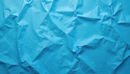 Bright blue crumpled paper surface with wrinkled texture. Abstract backdrop. Folded sheet background for graphic design, art projects. Blank space with rough crumpled for creativity.
