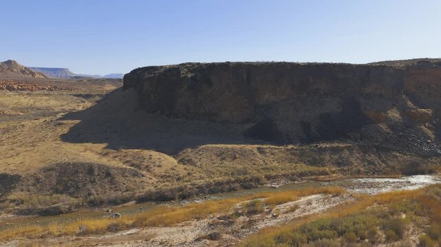 VIRGIN RIVER GORGE, UTAH, USA - February 07, 2025: Aerial-Virgin River-Black basalt cliffs