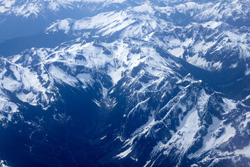 An Aerial View Above Snowy Mountain Tops
