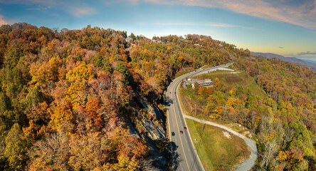 Wide multilane highway road in USA Appalachian mountains with fast driving cars. Above view of American transportation infrastructure