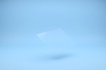 Empty room with light blue background and rectangular transparent shape
