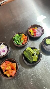 Indonesian traditional spices herbs and seasoning for cooking meal or food in small pottery plate