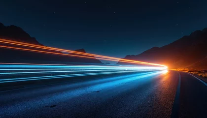 Fototapeten Night highway with light trails of speeding cars. Long exposure photo. Headlights and taillights create motion blur. Dark sky with stars and mountains on the horizon. Modern tech, transport. © Vadym