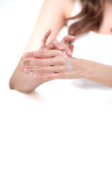 A portrait of a young Asian woman posing in a studio