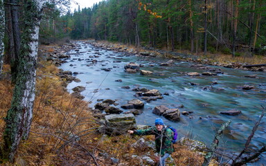 Water autumn landscape. A shallow fast mountain river with a rocky bottom. Ural.