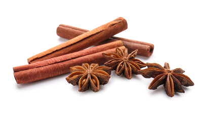 Star anise with cinnamon sticks on white background