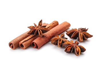 Star anise with cinnamon sticks on white background