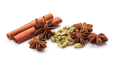 Star anise with cinnamon sticks and cardamom seeds on white background