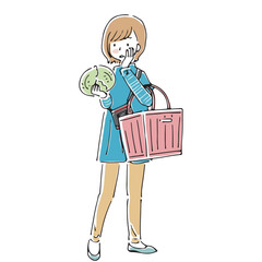 レジカゴを持ってキャベツの品定めをする主婦