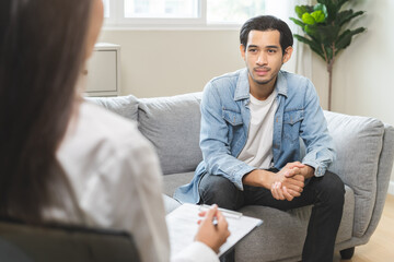 Psychology, depression. Suffer asian young man consultation with psychologist while patient...
