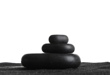 Black beach sand with pebbles on white background