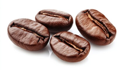 Obraz premium Close-up view of four roasted coffee beans showcasing their rich texture and color on a white background