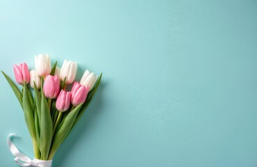 Pastel blue background with spring flower composition. Bouquet of pink, white tulips flat lay with copy space for Valentine Day, Easter, Birthday, Women and Mother Day cards.