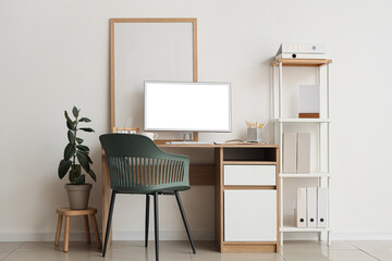 Comfortable workplace with computer in interior of office