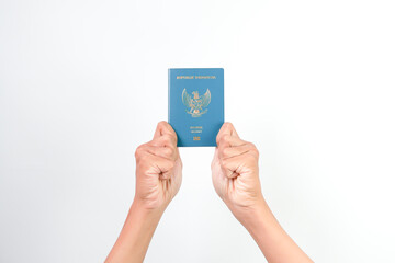 Hand of Indonesian man holding Indonesian Electronic Passport isolated on white background.