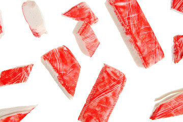 Cut tasty crab sticks flying on white background © Pixel-Shot