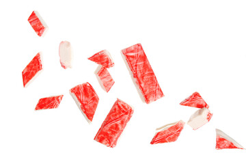 Cut tasty crab sticks flying on white background © Pixel-Shot