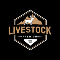 Vintage Logo featuring Deer Standing in Grass Field, with Mountain background in Hexagonal Frame. Suitable for livestock, organic meat business