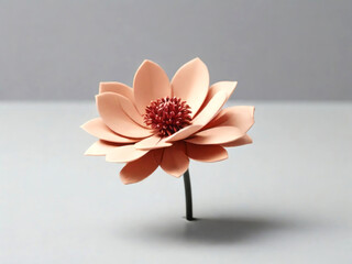 Crafted Peach-Colored Flower with Dark Red Center Against Neutral Gray Background