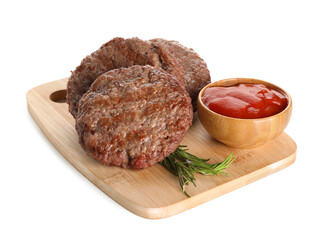 Wooden board with tasty meat cutlets, bowl of ketchup and rosemary on white background