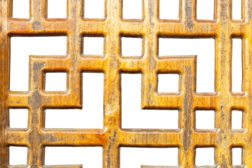 A close-up shows a wooden lattice with square. The wood has a warm, golden hue a varnished or surface. The geometric pattern creates a sense of depth and texture isolated on white background.