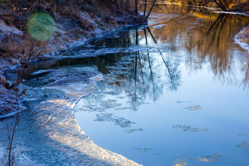 beautiful landscape of freezing river sunny november day