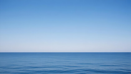 Obraz premium Simple calm blue sea, ocean under a blue sky. Calm mood, mood photo, sea, sky background. Landscape. heaven, dawn. Spiritual, wellness, meditation, summer, zen. 