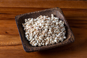 Job's tears on wooden background