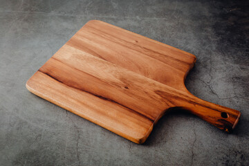 cutting board on wooden board