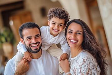Modern muslim family. Happy mother and father with son, hugging together
