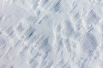 The snow is white and the ground is covered in it