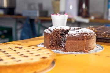 Chocolate cake with powdered sugar on table