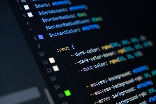 close-up of computer screen with colorful css code, focus on root selector, web development, frontend design and programming