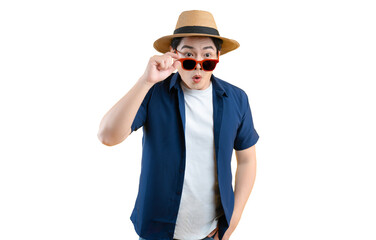 Portrait of a young Asian man wearing a tourist shirt, hat, and sunglasses posing on background