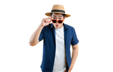 Portrait of a young Asian man wearing a tourist shirt, hat, and sunglasses posing on background