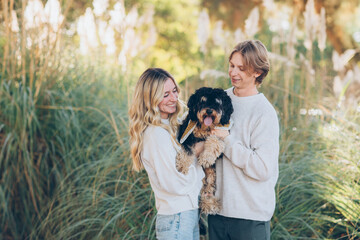 Young Couple Posing with their dog