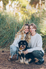 Fototapeta premium Young Couple Posing with their dog