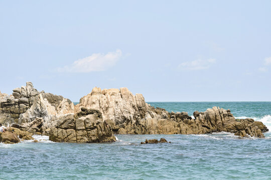 rocks on the blue sea of ​​Puerto Escondido Oaxaca, Mexico