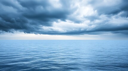 Obraz premium Dark Storm Clouds Over a Calm Ocean Surface