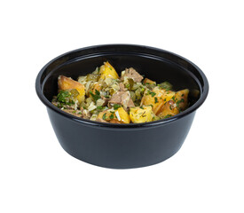 A black bowl filled with a delicious variety of food on white