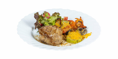 A white plate with meat and vegetables on a white background