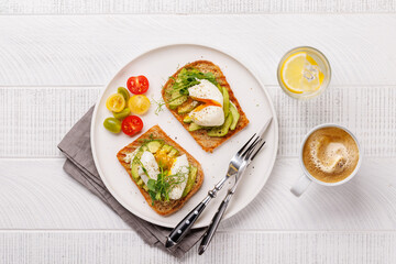 Delicious avocado toasts topped with perfectly cooked poached eggs