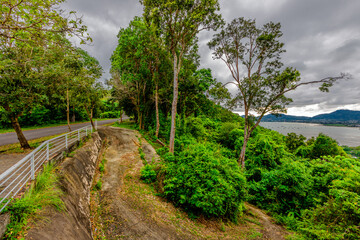 Nature background of the seaside forest, mangrove forest with large mountains surrounding, clear sky and cool breeze during adventure travel.