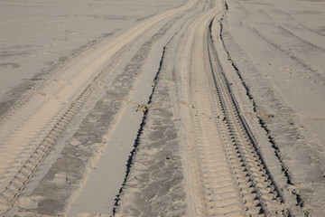 vehicle car tyre trail at sand desert beach off road track