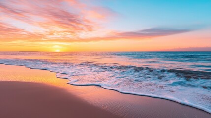 Obraz premium A serene beach scene at sunset, featuring vibrant colors in the sky and gentle waves lapping at the shore, creating a tranquil atmosphere.