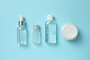 Natural cosmetic products on a blue background, top view