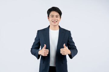 Portrait of young Asian business man posing on white background