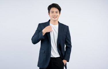 Portrait of young Asian business man posing on white background