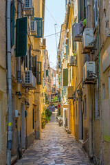 A quiet residential road in the historic centre of Corfu Old Town, Greece. A UNESCO World Heritage Site, it is a stunning blend of Venetian, French and British architectural influences. 