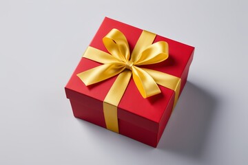 there is a red box with a gold bow on it
